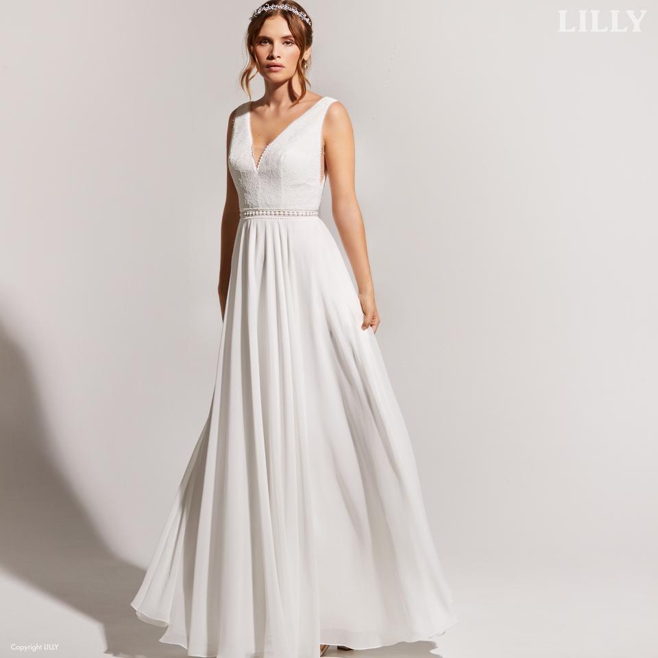 Clean cut and minimalist bridalgown in a flowing fabric by LILLY
